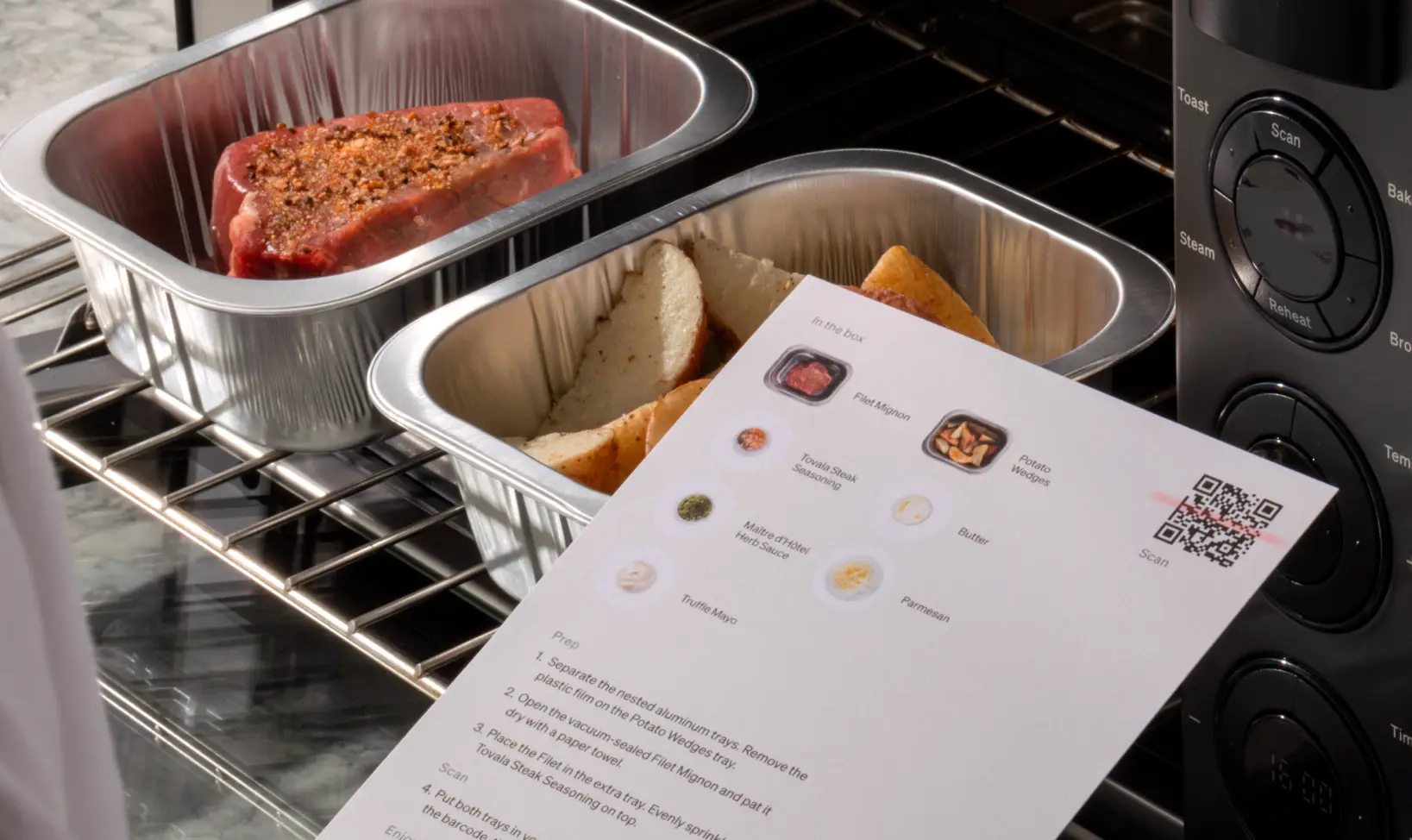 A person holding a sheet of paper with a QR Code under the scanning feature of the smart oven. 