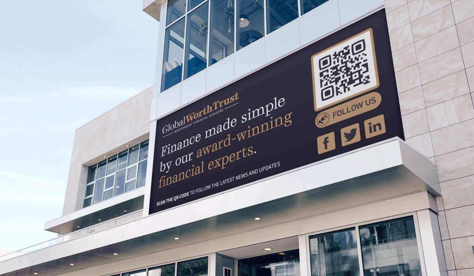 A Finance company's billboard containing a QR Code with a "Follow Us" frame 